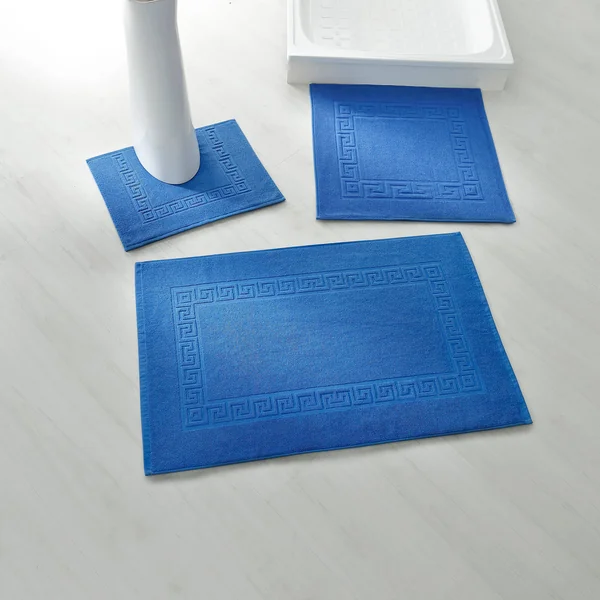 Tapis de bain éponge liteau motif frise grecque, bleu dur